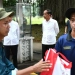 Presiden Joko Widodo menyaksikan penyerahan bantuan paket sembako bagi masyarakat di sekitar Kompleks Istana Kepresidenan Bogor