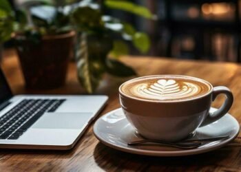 Download Close up of a laptop and coffee for free