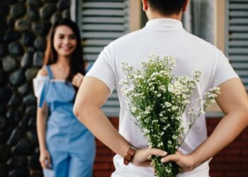 Photo by Vija Rindo Pratama: https://www.pexels.com/photo/man-holding-baby-s-breath-flower-in-front-of-woman-standing-near-marble-wall-935789/