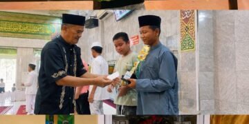 Julian Fareza menunjukkan medali perak yang diraihnya pada ajang Sirkuit FORKI Riau 2026. Dukungan keluarga dan kedisiplinan berlatih di Club Baterai C menjadi kunci sukses atlet muda ini.