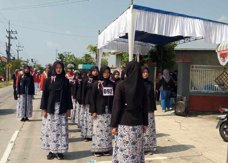 Hitam, Batik, dan Kompak: Regu 92 MTs Muhammadiyah 20 Menongo Ukir Kebanggaan di Jalanan Sukodadi 5 foto landscape kecil 3 1