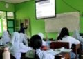 Pembelajaran Pertumbuhan Ekonomi di Kelas XI-I SMA Negeri 2 Klaten Dorong Pemahaman tentang SDGs 8 9 PK Muhammad Farros Hidayat