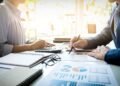 Sumber Daya Terbatas, Target Tak Terbatas: Bagaimana Akuntansi Manajemen Membantu Perusahaan Bekerja Lebih Optimal 7 business man financial inspector and secretary making report, calculating or checking balance. Internal Revenue Service inspector checking document. Audit concept